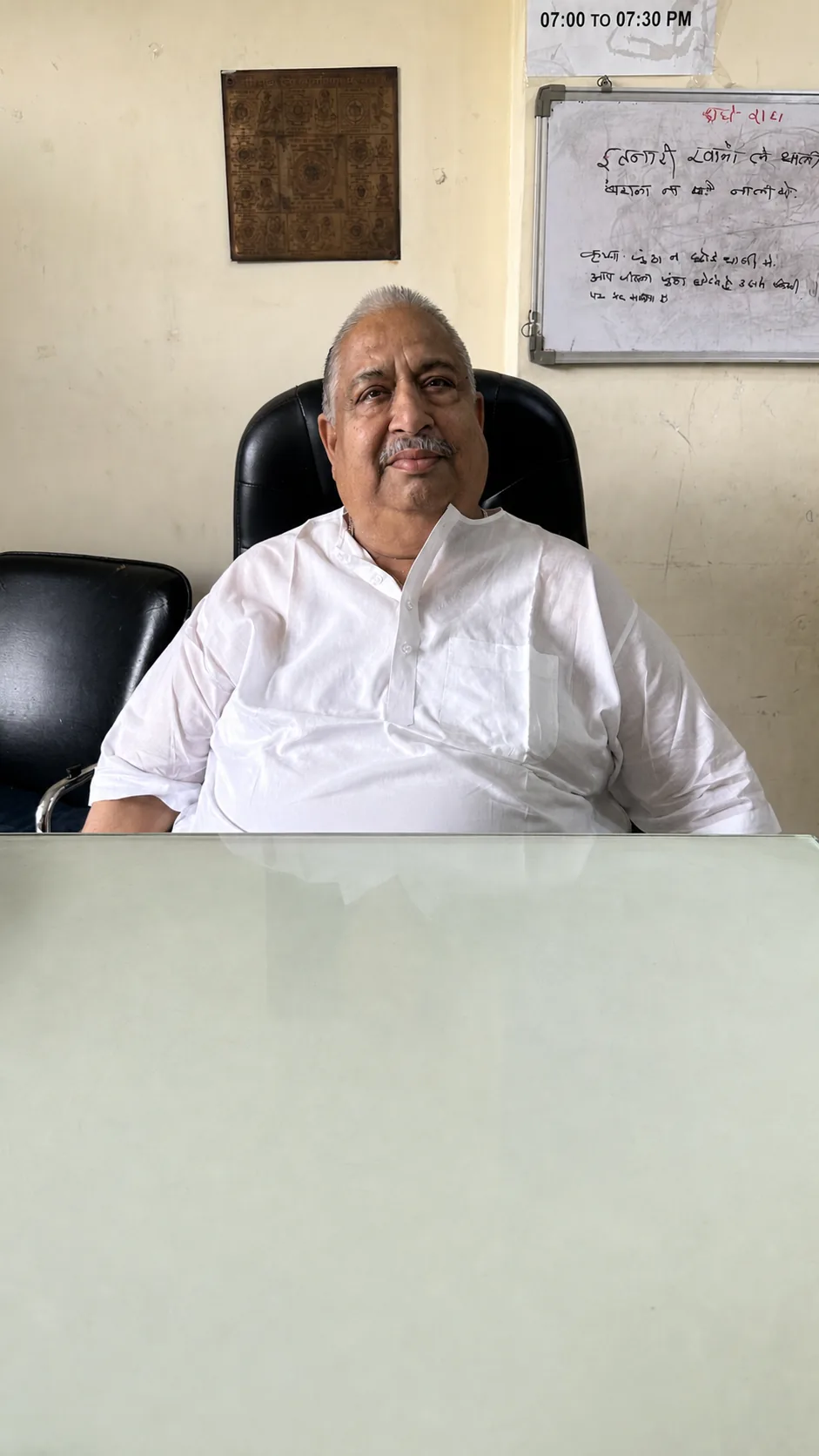 Portrait of the PJ PG caretaker seated at the front desk