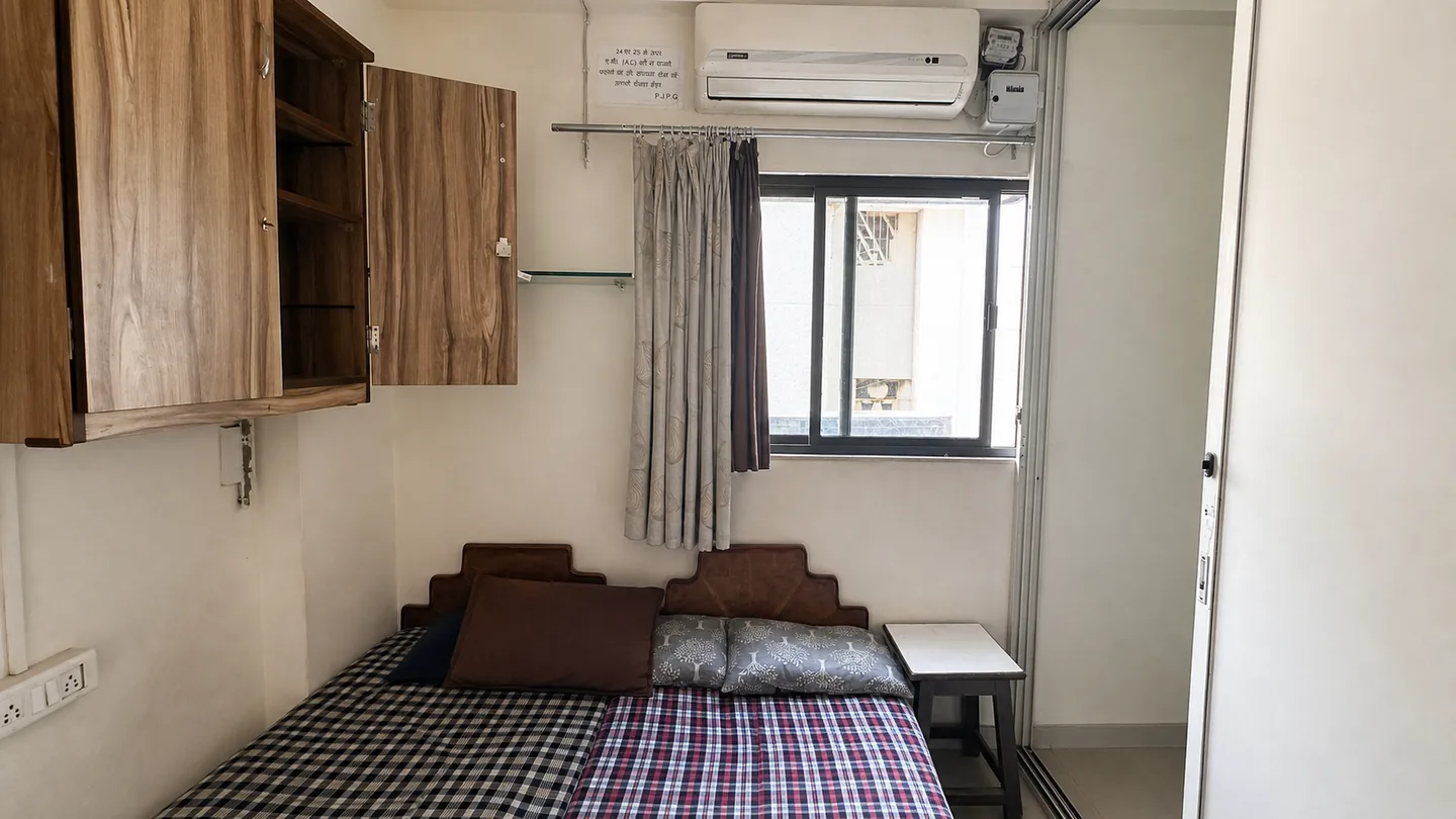 Wide view of a furnished PJ PG room with beds, storage and daylight